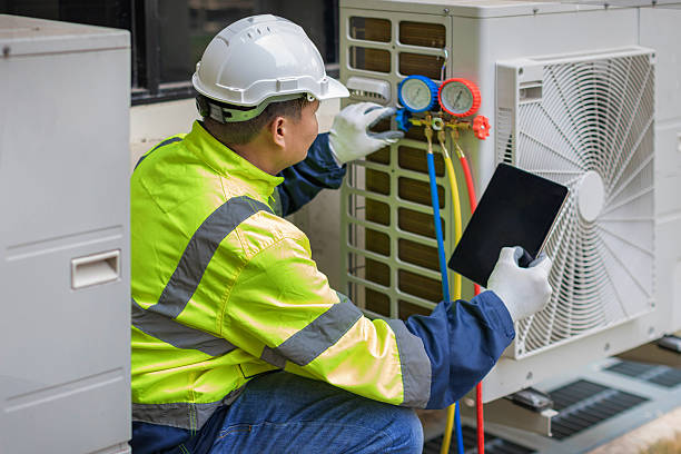 Professional Air Conditioning Repair technician working in Chenoa, IL